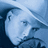 Blue-toned pixelated image of a person wearing a hat, with text on yellow background reading "swingin with your old friends" and "prayin that it never ends wouldn't trade a single day"