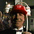 A pixelated contact sheet showing two frames of an animated icon featuring a person in military attire with a red beret and white gloves, alongside green text reading "Original Icons .com" on a dark background.