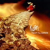 Pixelated static image of a red-clad figure standing on a rocky cliff edge with fiery background and text reading "KoAn" in white letters.