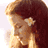 Static pixelated image of a person with long dark hair and light skin, cropped closely to the head against a white background.