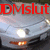 Red text 'DMSlut' overlaid on a pixelated image of a car with headlights on, set against a blurred background.