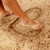 A four- shows a pixelated beach scene with feet drawing in sand, a blue with 'matt' text and a play button, a pink with '11/11' text, and a gray