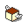 Pixelated cube with brown top and light yellow sides, white wing-like shapes on sides, rotating in a