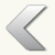 A pixelated left-pointing arrow icon with a gradient fill transitioning from white to gray, rendered in grayscale tones on a plain background.