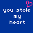 Blue background with white pixelated text reading 'you stole my heart' and a pink pixelated heart symbol above the left side of the text.