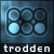 Pixelated grid of six circular shapes in varying shades of blue on a dark background with the word 'trodden' below.