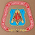 Animated icon with a blue shield, red gem, and golden cross inside a pink border on a brown background.