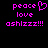 Pixelated text in bright pink on black background: 'peace' with heart symbol, 'love', 'ashlizz!!!' repeated side-by-side.