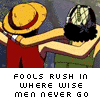 Animated sequence of two anime characters embracing, with pixelated text below each frame.