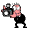 Pixelated cartoon character in black suit holding camera with flash, showing sequential animation frames of flash firing and facial expression changes.