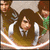 Animated icon shows a character with long brown hair in white and dark clothing, surrounded by others against a beige background.