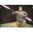 A 7-frame animated contact sheet showing a person in gray clothing swinging two glowing lightsabers against a dark background with yellow ground, captured from an iconic viral video sequence.