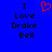 Blue background with black text reading "I Love Drake Bell" and a red pixelated heart symbol above the text.