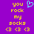Purple background with yellow text reading 'you rock my socks' and three yellow '<3' symbols, plus a cyan heart symbol above the text.