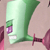 Green and purple pixelated figure with a large green head, purple lower face, and pink accents on a light brown background.