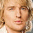 Animated sequence of a person with light brown curly hair in close-up views against red and gray backgrounds, with text reading "STARSky & HUTCH" at the bottom.