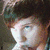 A four- shows a person with brown hair in various poses, including one with the text "ZACH" on black background