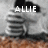 Pixelated static image shows white text 'ALLIE' over a grayscale background with brown lower section, featuring a stylized 'A' with a small triangle above it.