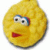 Yellow circular character with large eyes and red mouth, pixelated rendering on white background.