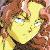 Pixelated close-up of a figure with light brown hair and a yellow garment, showing partial facial features and a dark collar.
