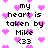 Pixelated text reads 'my heart is taken by Mike <33' surrounded by pink hearts on a white background.