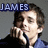 Pixelated image of a person with brown hair wearing dark and blue clothing, holding hand near face, with 'JAMES' text above head on dark background.