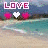 Pixelated beach scene with 'LOVE' text and three hearts in two animated states.
