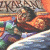 Pixelated image split into two sections: left shows a figure in motion with blurred colors, right displays green text on dark background.