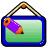 Two pixelated hanging signs with green backgrounds, each holding a pencil; left sign has blue frame and purple pencil, right sign has brown frame and green pencil.