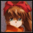 Pixelated anime-style character with brown hair and red bow, wearing orange top, next to black background with white text.