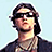 Pixelated image of a person with dark hair and sunglasses on the left, next to blue background with pixelated text reading "Viva La..." above "Ya thats right" below.