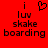 Red background with black pixelated text reading 'i luv skake boarding' and a heart symbol above the 'l' in 'luv' on the left side.