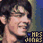 A 48x48 pixel animated buddy icon featuring a male character with dark hair and light skin, displayed in two side-by-side frames showing slight facial expression changes, with "MRS JONAS" text at the bottom of each frame.