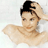 Static 48x48 pixel icon showing a person with dark hair tied up, wearing a white towel around their shoulders in a bathroom setting.