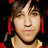 Pixelated image of a person with brown hair and red earrings, overlaid with bold red text reading 'pete is sexy!!' and 'very sexy!5 love him!' on black background.