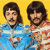Two pixelated figures with dark hair and mustaches stand side-by-side against a solid yellow background, wearing blue and red-and-white striped shirts.