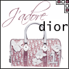 A pink and white Dior handbag with floral patterns, 'J'adore' script, and 'dior' text on a white background.