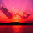 Pixelated sunset scene with orange and pink sky reflecting on water, paired with purple background text 'purdy y xoxoxo' in white pixel font.