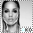 Black-and-white pixelated portrait of a person with long hair, wearing earrings, and a light-colored top, with partial text 'AKO' visible below.