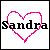Pixelated heart outline in bright pink with black text 'Sandra' overlaid on a white background.