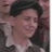 Pixelated image of a person with dark hair and light-colored collar on left, cyan background with blue pixel-art text reading "Look at me I'm the king of New York" and "suddenly I'm respectable staring right at ya lousy with stature".