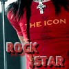 A person in a red shirt with 'THE ICON' text, wearing a silver cross necklace, standing near a microphone with 'ROCK STAR' text overlay.