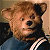 A split-frame contact sheet showing a pixelated bear mascot on the left and green text reading "Original Icons .com" on the right against a dark background.