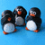 Three pixelated penguins stand on a blue background; the rightmost penguin's text changes from 'see no evil hear no evil speak no evil' to empty.