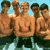 Pixelated static image of five shirtless men standing closely together in a group pose against a light blue background with green lower elements.