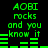 Green pixelated text and audio visualizer bars on black background, repeating 'AOBI rocks and you know it' with animated bar movements.