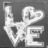 Pixelated grayscale icon with stylized white text 'LIFE' on dark background, featuring a heart symbol replacing the 'I' and a small square frame in the top-left corner.