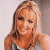 A 50x50 pixel animated buddy icon featuring a blonde woman on the left and green text reading "Original Icons .com" on the right, displayed as a contact sheet with two frames.