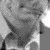 A black-and-white animated sequence showing a person in a collared shirt with subtle facial expressions and head movements
