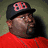 A person wearing a black cap with red 'BB' logo and red shirt appears on the left, while two versions of a stylized 'BB' emblem are displayed on white backgrounds.